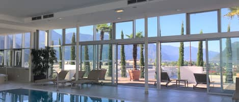 Indoor pool, open 6:00 AM to 9:30 PM, pool loungers