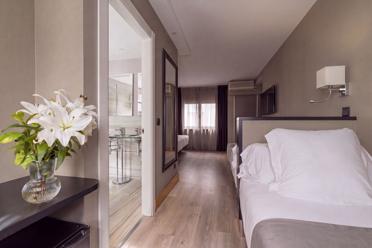Family Quadruple Room | Premium bedding, minibar, in-room safe, desk