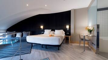 Luxe beddengoed, een minibar, een kluis op de kamer