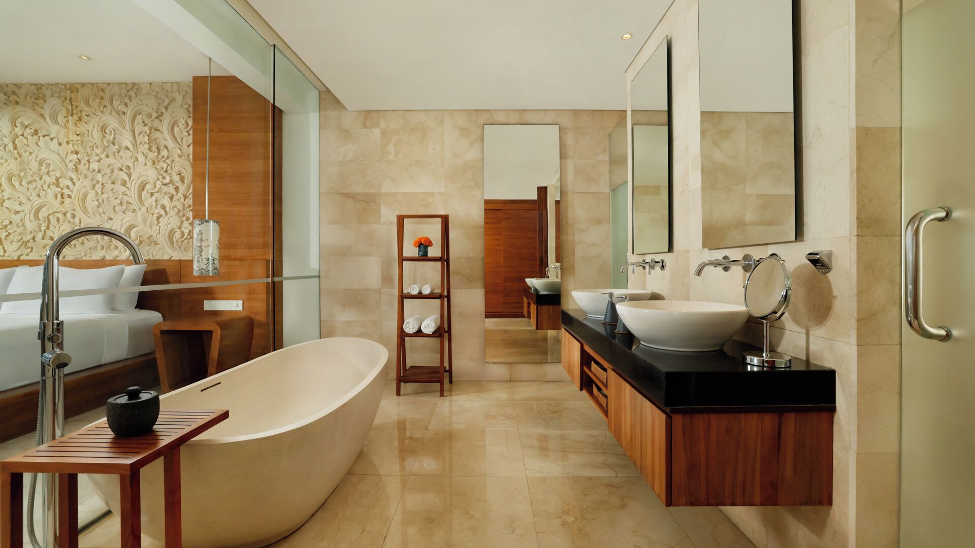 A modern bathroom with a freestanding bathtub, a vanity with two sinks, and a large mirror.
