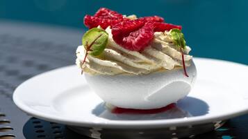 A dessert on a white plate with a blue background.