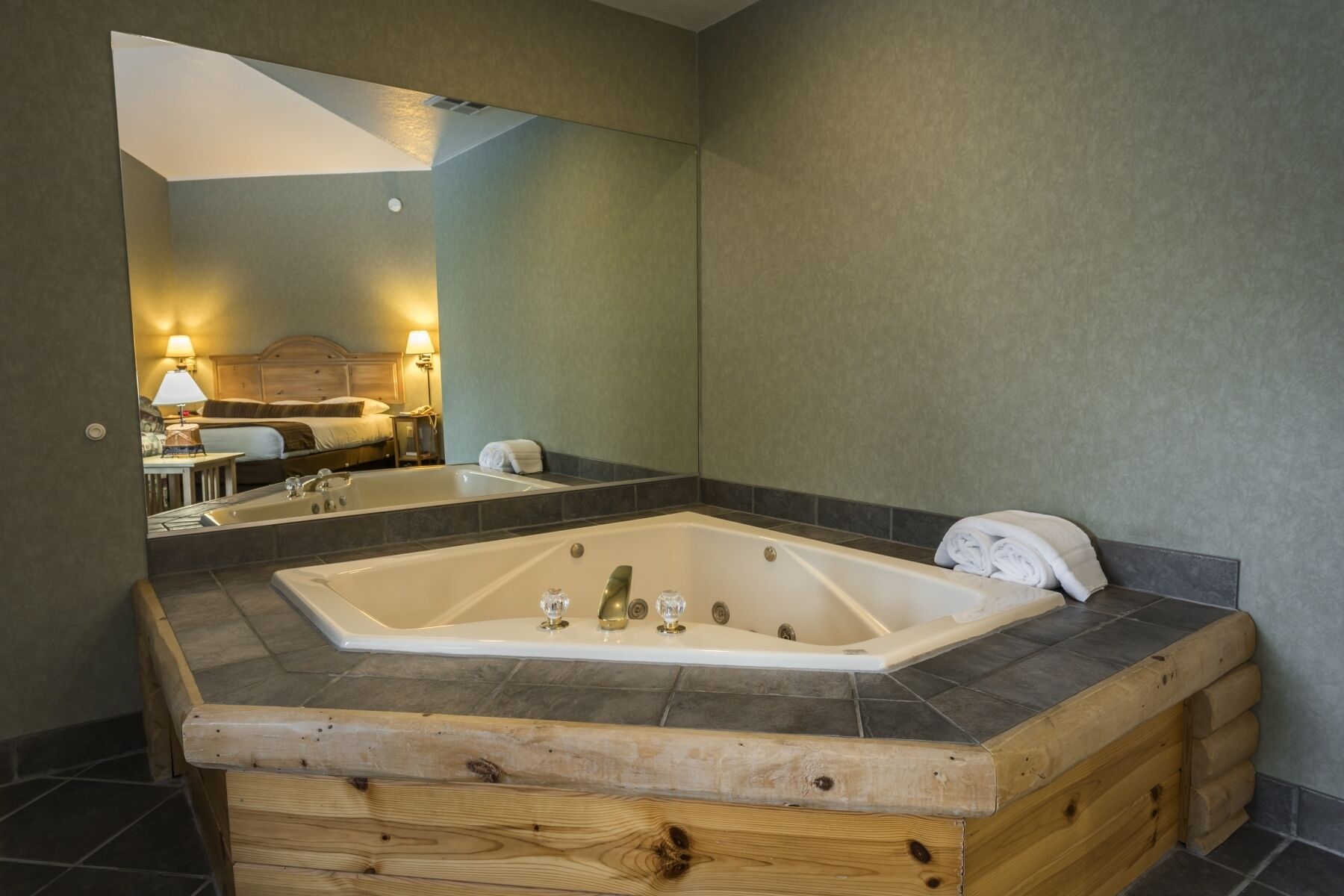 deluxe room, multiple beds, jetted tub | private spa tub