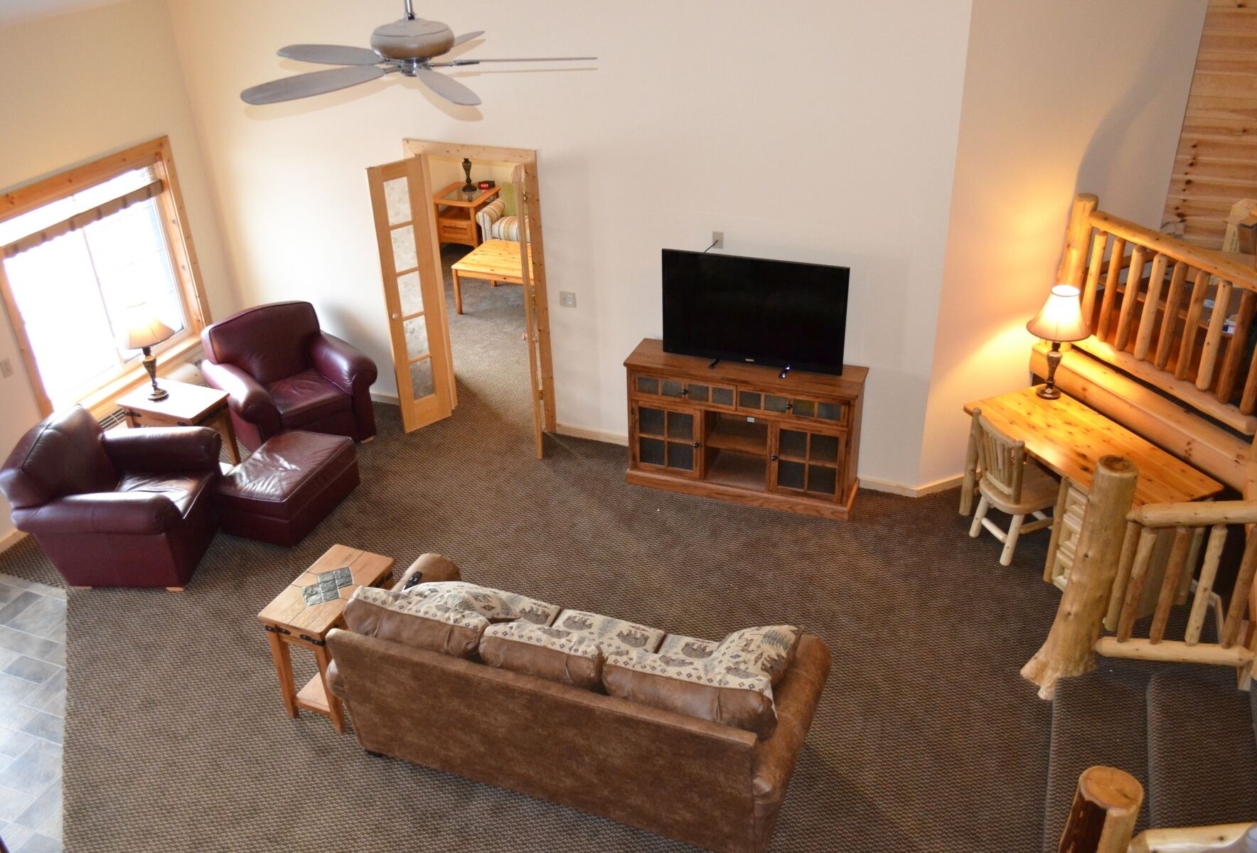 family suite, multiple beds, river view | living area | tv