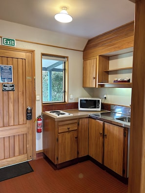 Suite, 1 Bedroom | Private kitchen | Fridge, microwave, coffee/tea maker, electric kettle