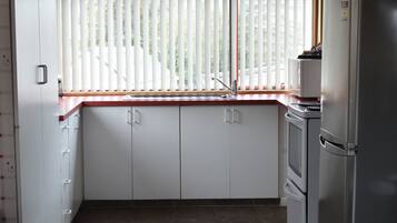 Two Bedroom Unit | Private kitchen | Stovetop, electric kettle, toaster