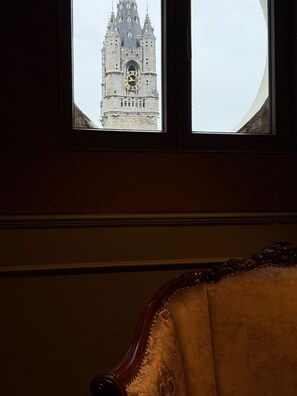 A window with a view of a clock tower. - Hotel Cour Saint Georges by CW Hotel Collection (Ghent)