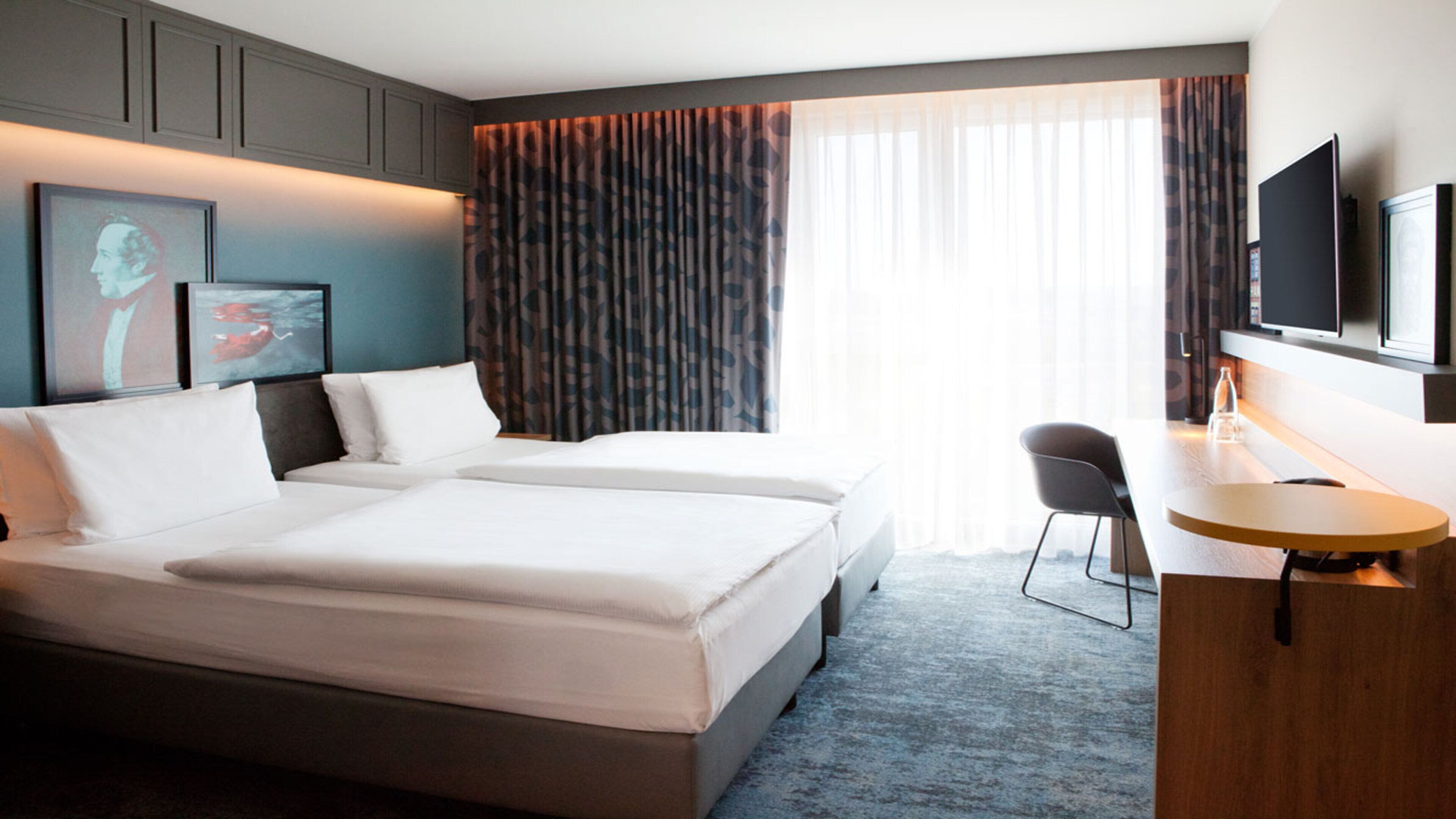 Hypo-allergenic bedding, desk, laptop workspace, blackout drapes