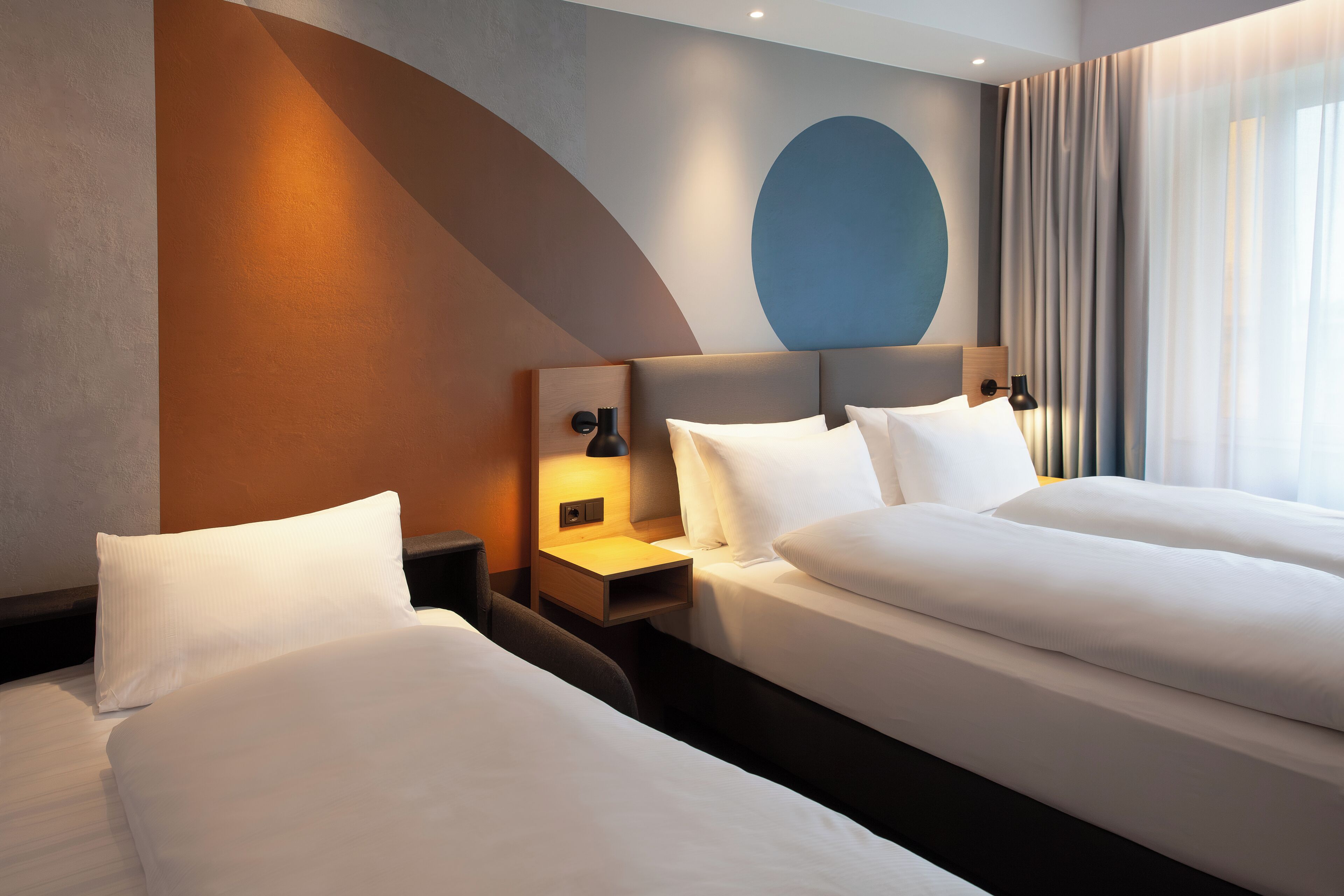 Hypo-allergenic bedding, desk, laptop workspace, blackout curtains