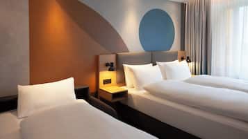 Hypo-allergenic bedding, desk, laptop workspace, blackout curtains