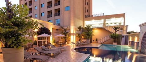 Outdoor pool, pool umbrellas, sun loungers