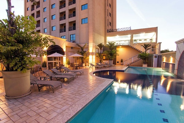 Outdoor pool, pool umbrellas, sun loungers