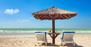 Private beach, white sand, sun-loungers, beach umbrellas
