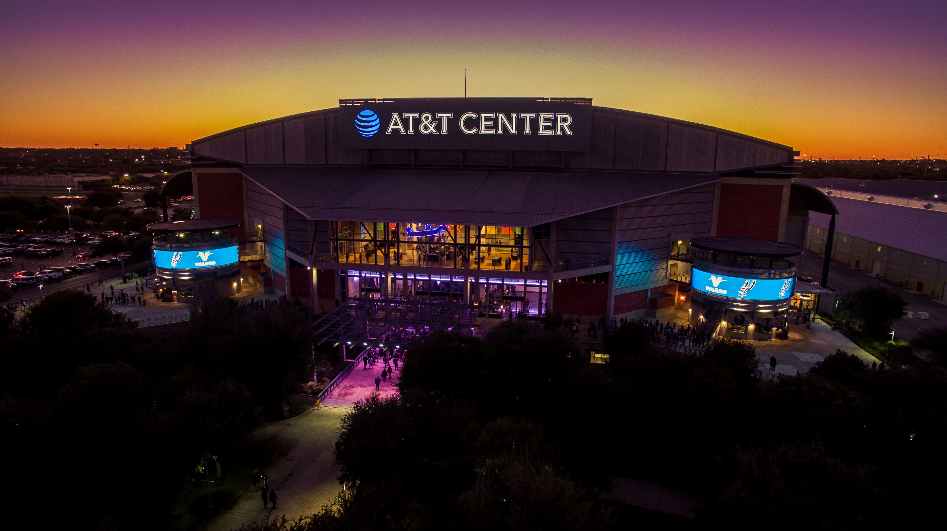 The AT&T Center with a large, modern architecture and a prominent sign.