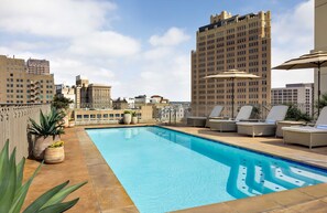 Outdoor pool, open 7:00 AM to 10:00 PM, pool umbrellas, pool loungers