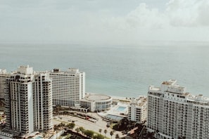 On the beach, white sand, beach towels, beach bar