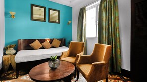 Suite with Airport Pickup | Living area | 32-inch plasma TV with satellite channels, TV