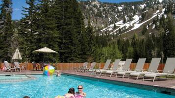 Relax by the pool surrounded by breathtaking mountain views.