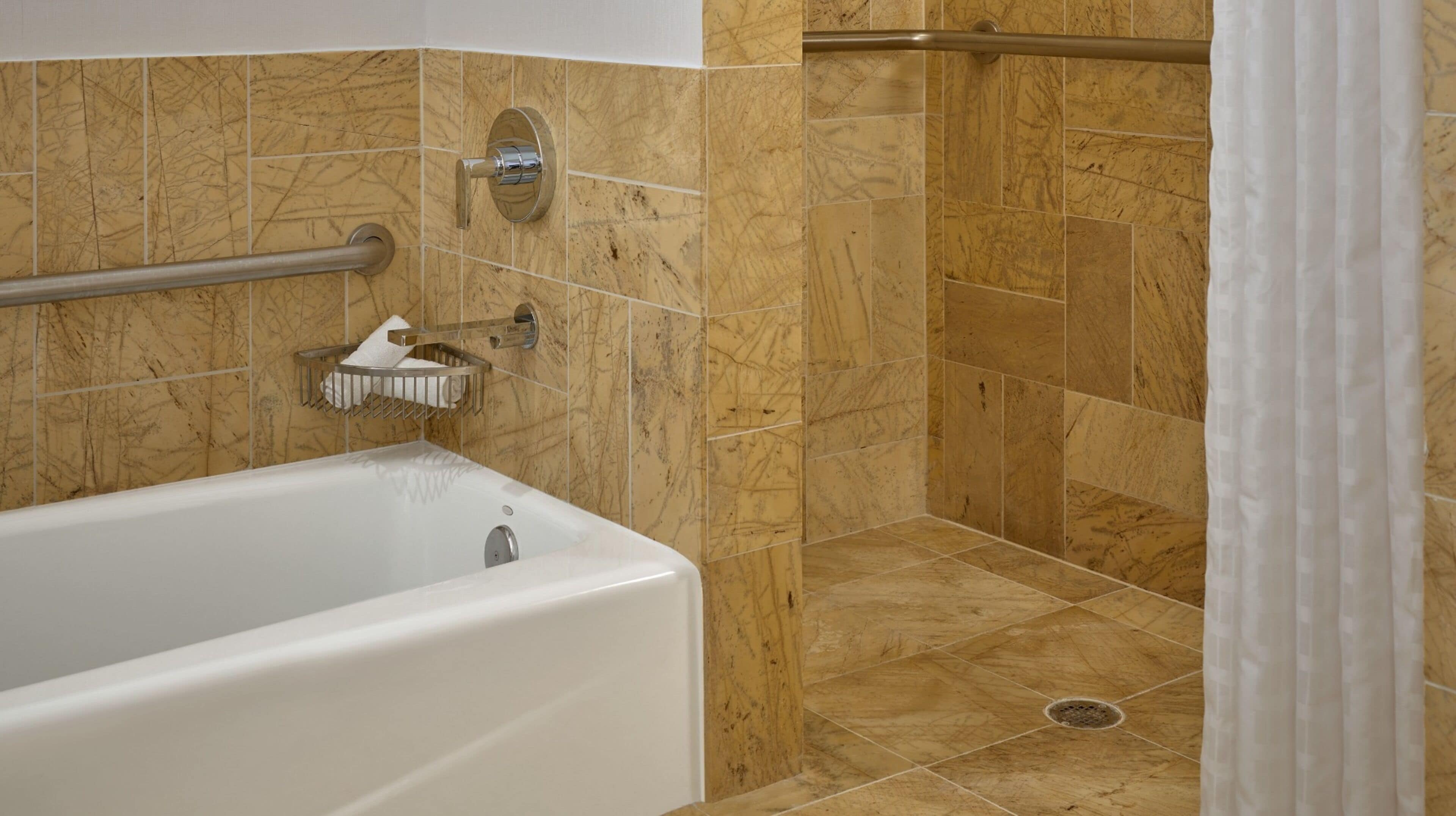 room, 1 king bed, mobility accessible, city view | bathroom | separate bathtub and shower, deep-soaking bathtub, designer toiletries