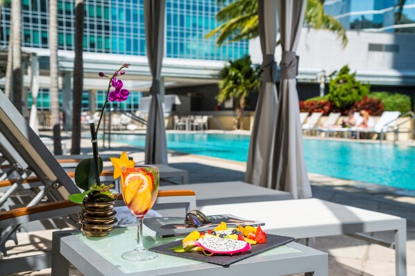 Outdoor pool, open 7:00 AM to 7:00 PM, cabanas (surcharge)