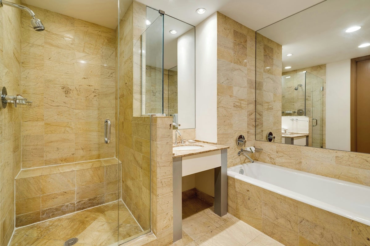 Separate bathtub and shower, deep-soaking bathtub, designer toiletries