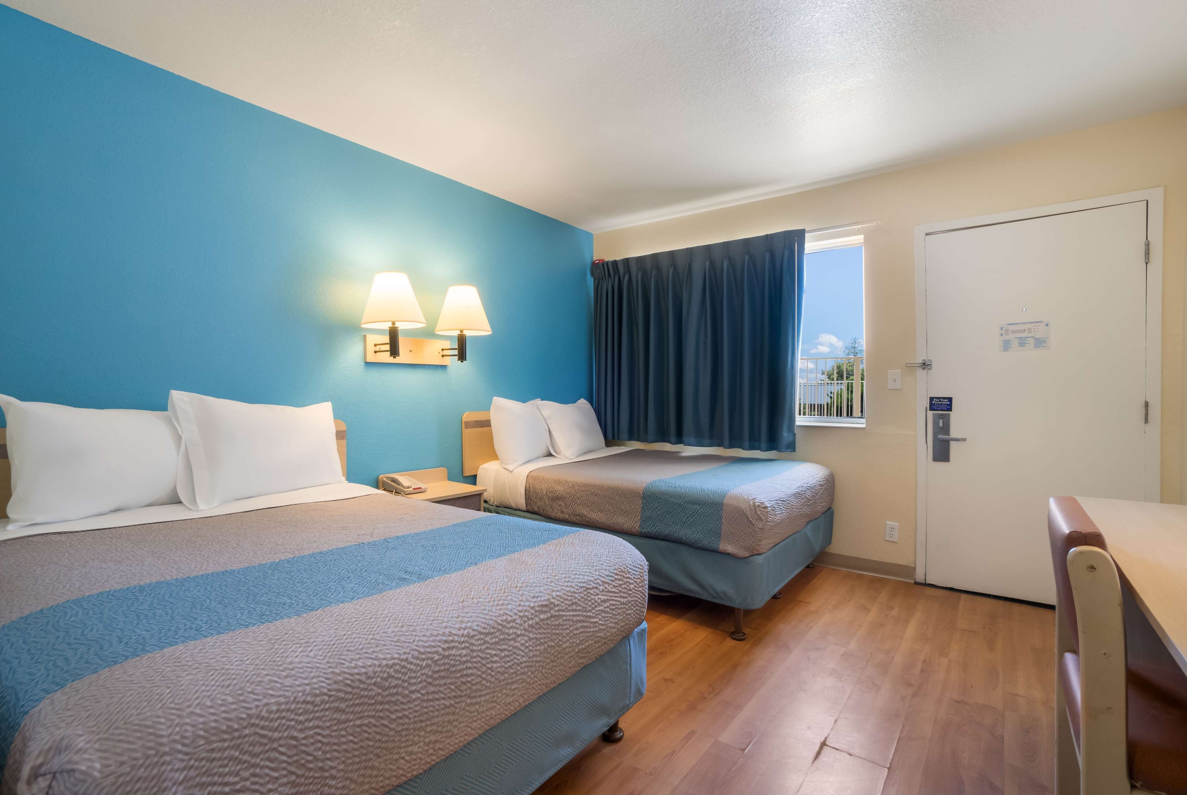 Desk, blackout curtains, bed sheets