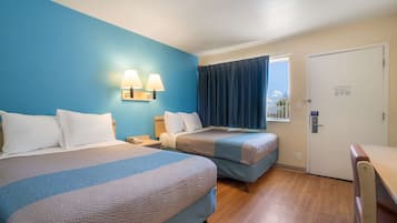 Desk, blackout curtains, bed sheets