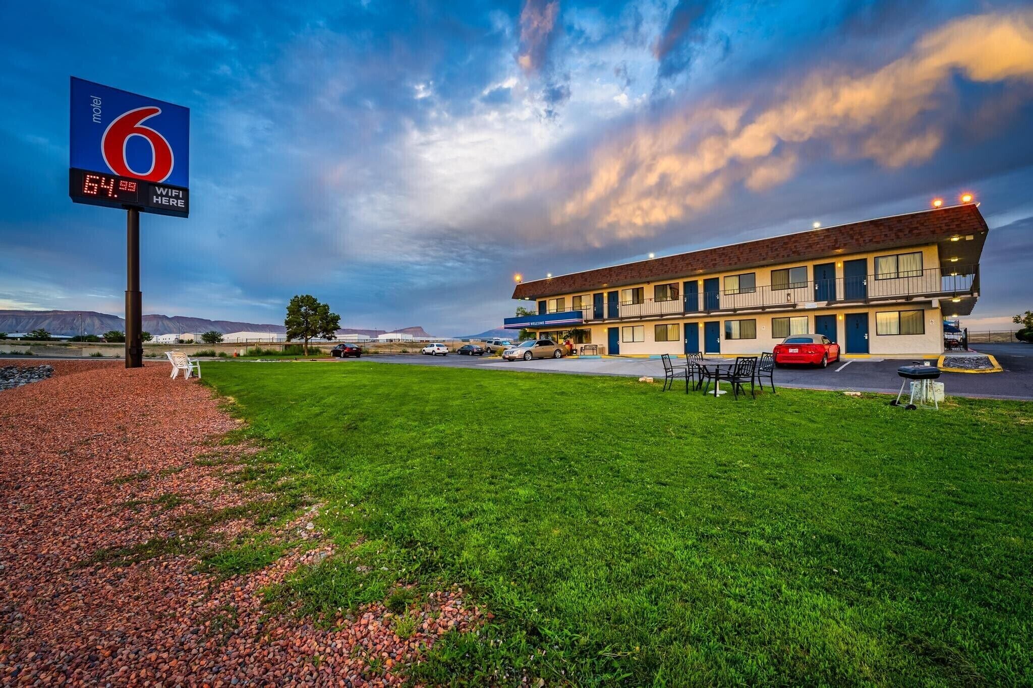 A motel with a sign indicating room number 6 and WiFi availability.