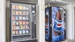 Two vending machines, one with a variety of snacks and the other with Pepsi. - Motel 6 Seattle, WA - South (SeaTac)