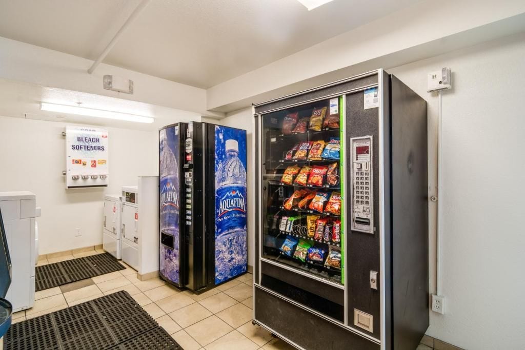 A vending machine area with a water dispenser and snack options.