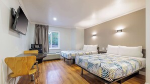 A hotel room with two beds, a desk, a chair, a flat-screen TV, and a window with curtains. - Motel 6 Auburn, CA (Auburn)