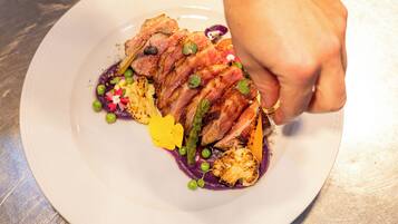 A plate of food with various ingredients and garnishes.
