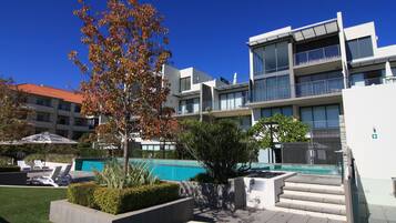 Outdoor pool, pool umbrellas, sun loungers