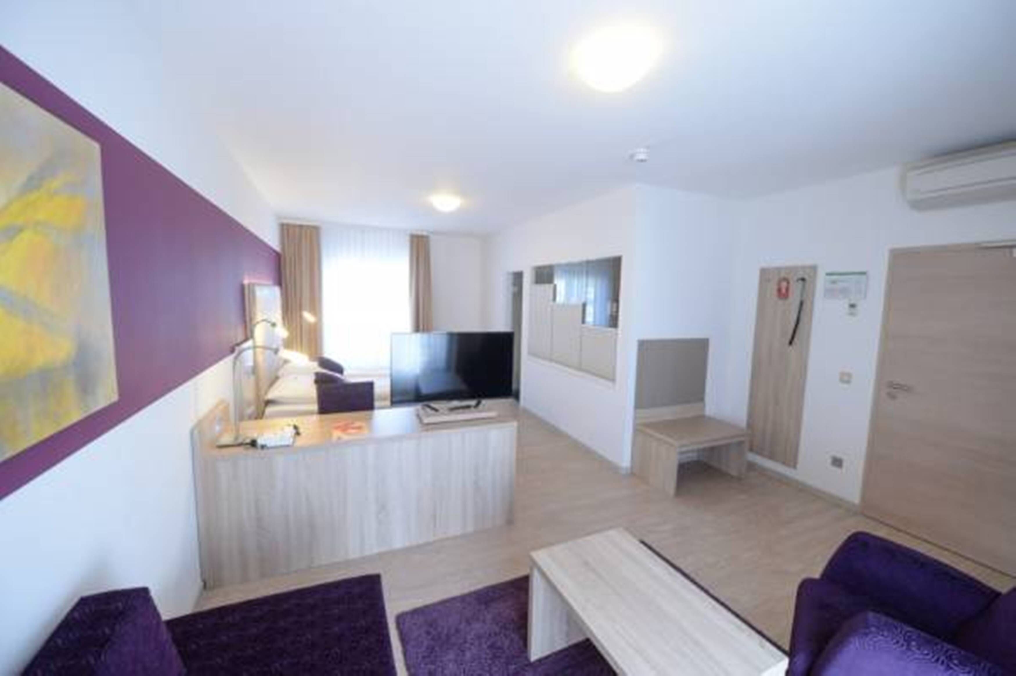 juniorsuite deluxe | living area | 42-inch smart tv with cable channels, netflix, streaming services