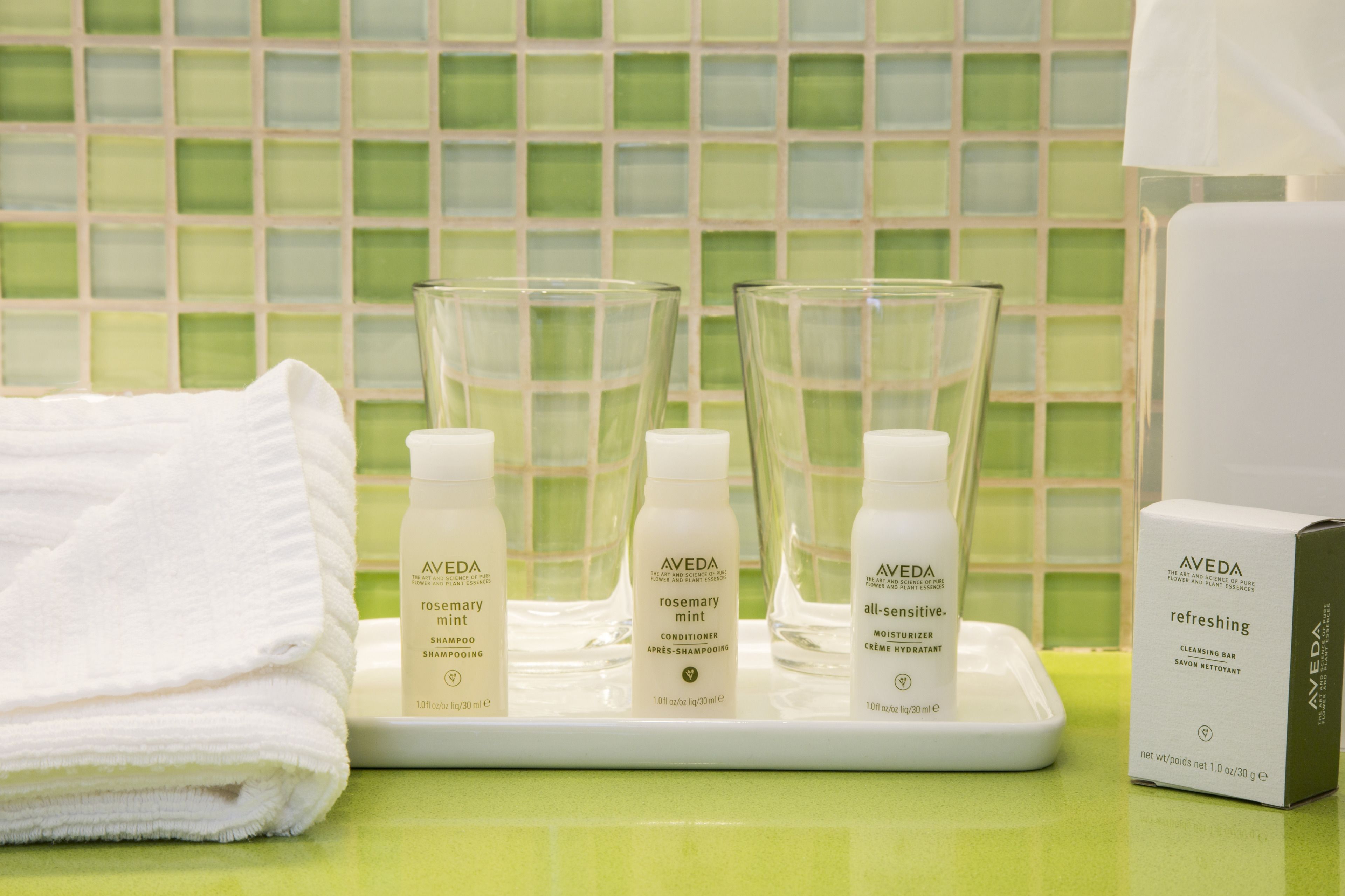 shower, designer toiletries, hair dryer, towels