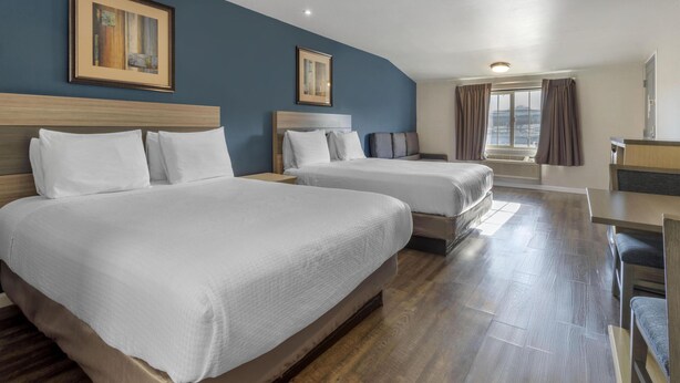 A hotel room with two beds, a desk, and a window with curtains. - SureStay Hotel by Best Western San Rafael (San Rafael)