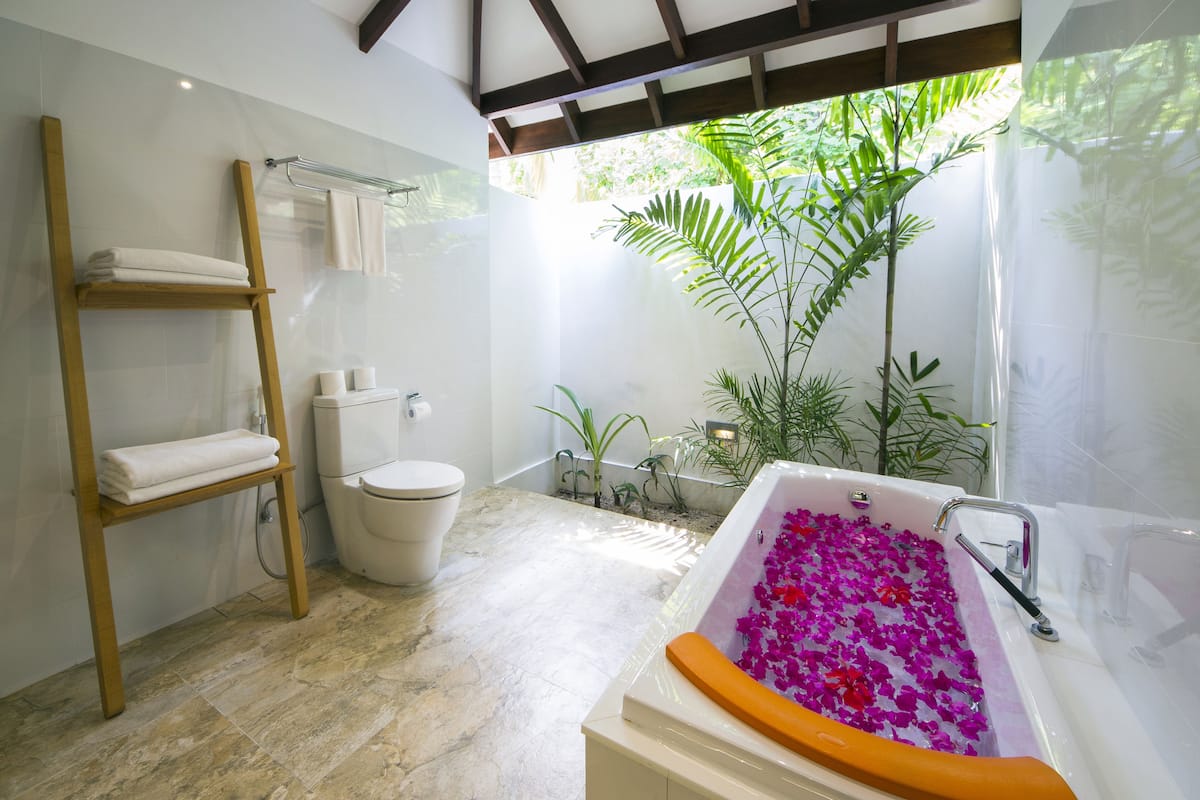 premium villa, beach view | bathroom | combined shower/bathtub, free toiletries, slippers, towels