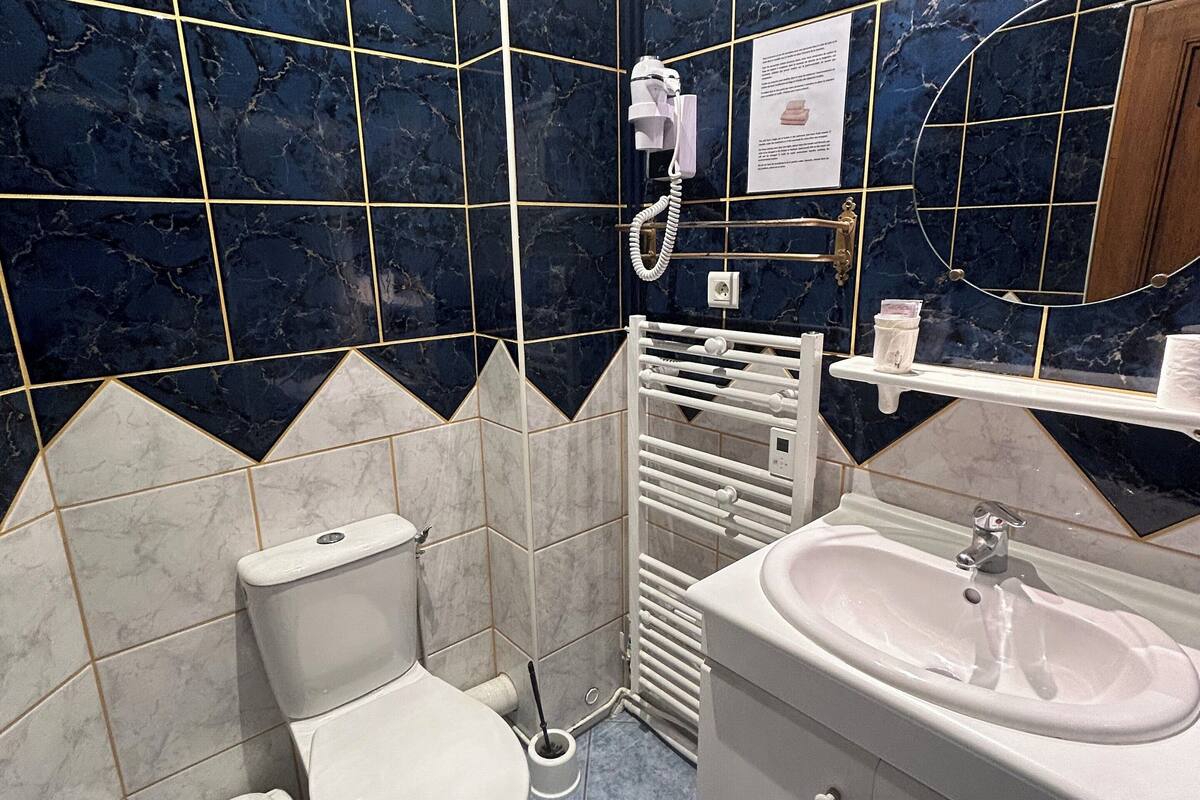 double superior, courtyard view and church | bathroom | free toiletries, hair dryer, towels