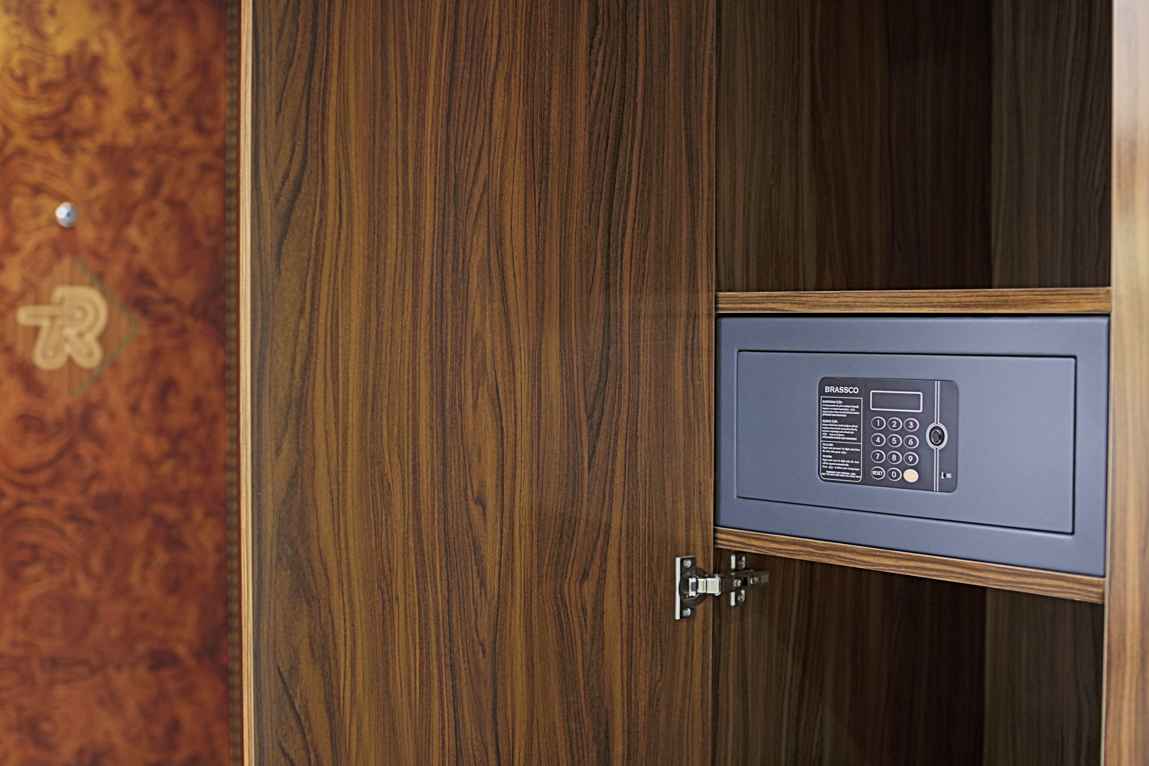 A wooden door with a security keypad lock.