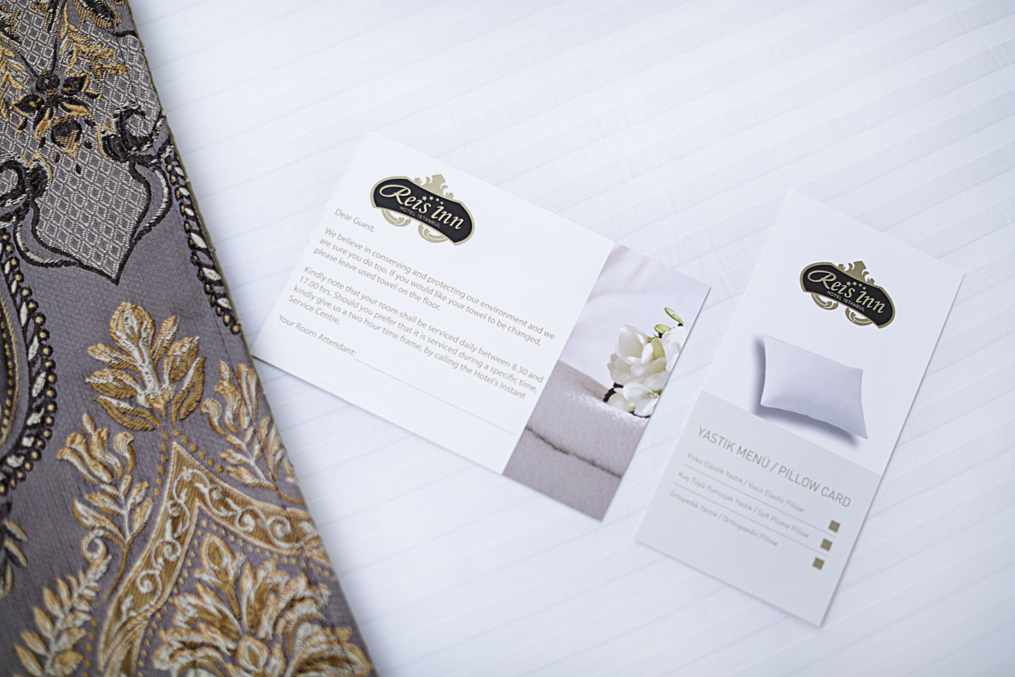 A brochure for Rees Inn, detailing room service hours and amenities like a Yastik menu/pillow card.