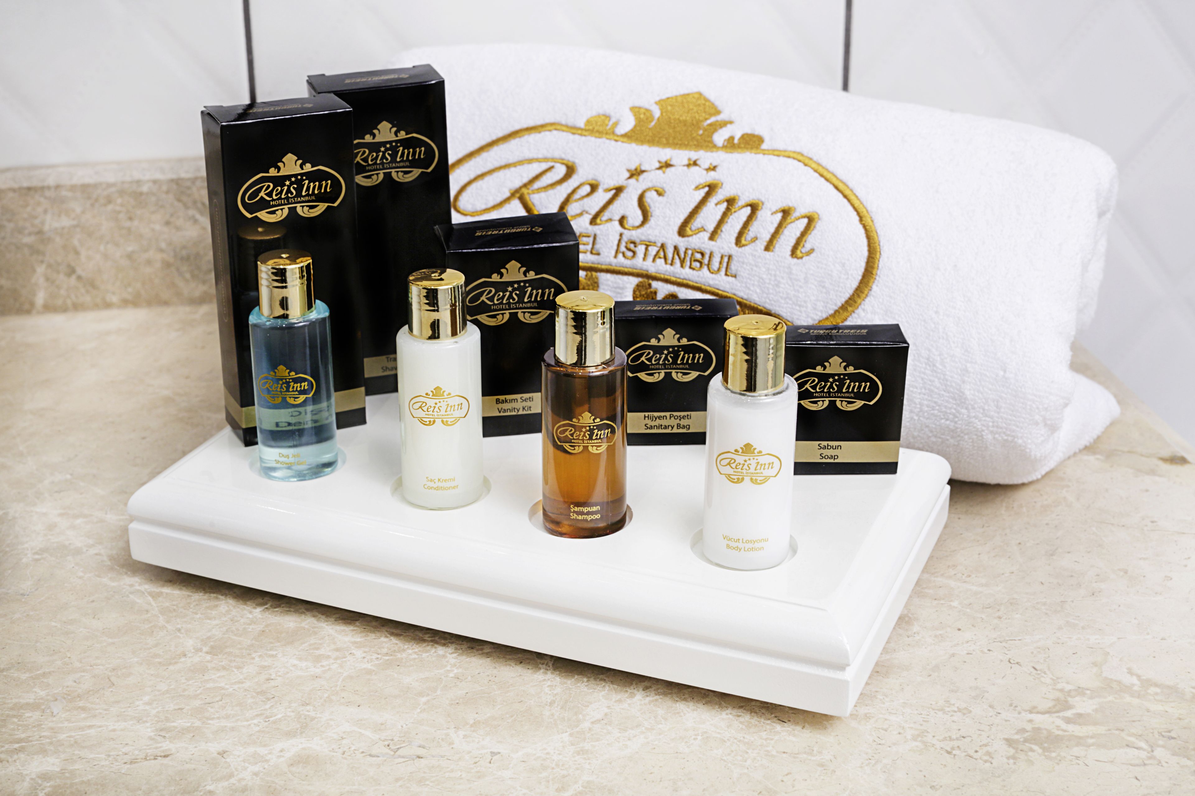A display of Reis Inn hotel toiletries on a tray.