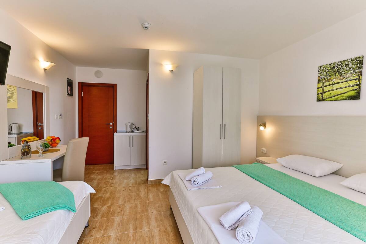 Triple Room, Balcony, City View | Minibar, in-room safe, free WiFi
