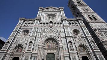 A large, ornate cathedral with intricate architectural details and a tall bell tower.