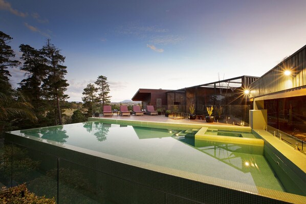 Outdoor pool, open 7:00 AM to 7:00 PM, pool loungers