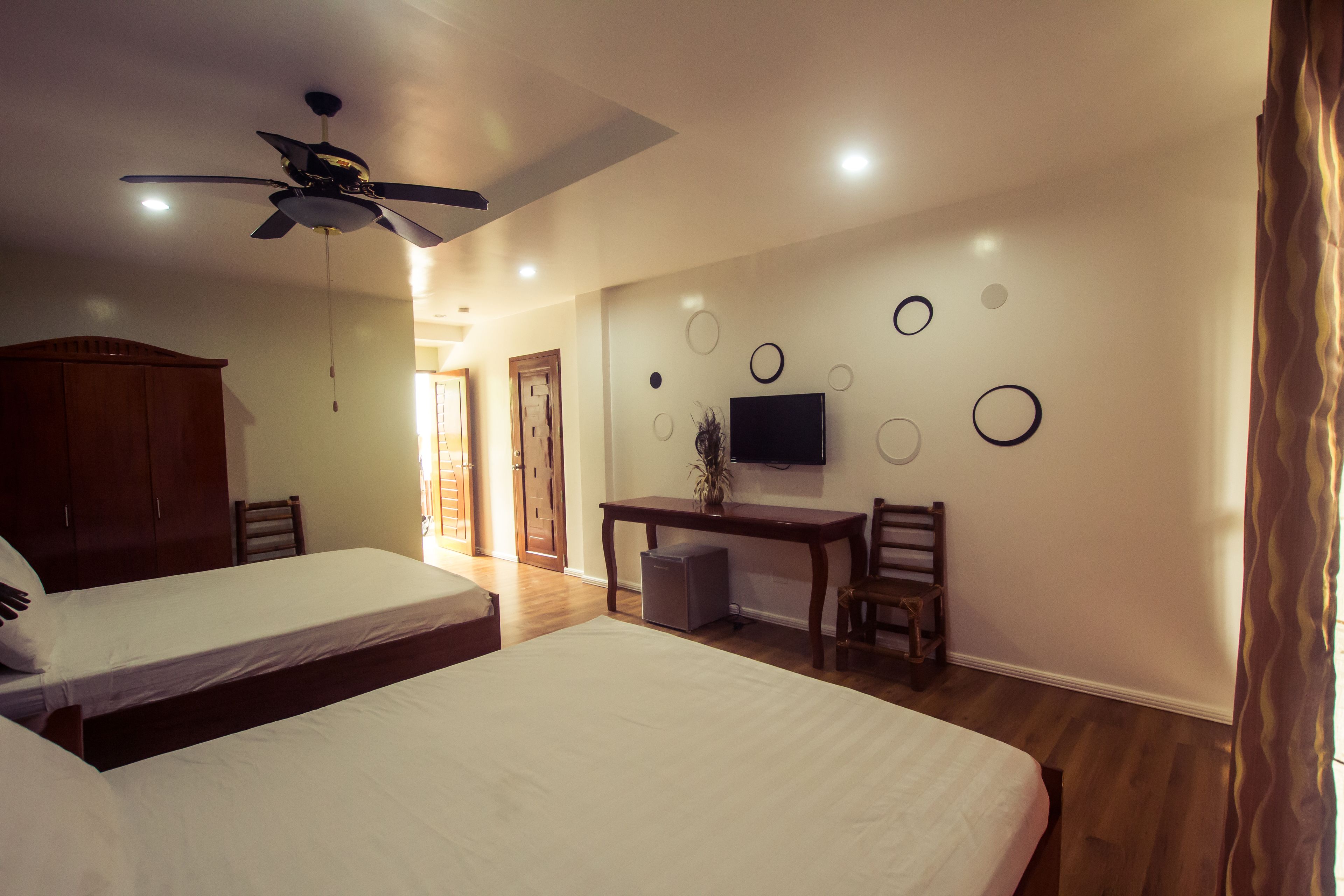 deluxe room, 2 queen beds, partial ocean view | in-room safe, desk, soundproofing, iron/ironing board