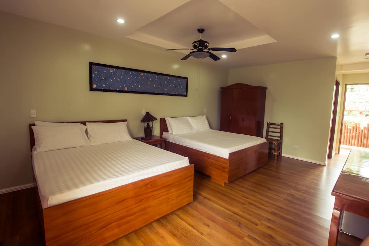 Deluxe Room, 2 Queen Beds, Partial Ocean View | In-room safe, desk, soundproofing, iron/ironing board
