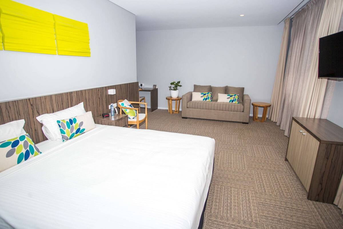 family room, 1 king bed with sofa bed, lake view | premium bedding, in-room safe, desk, soundproofing