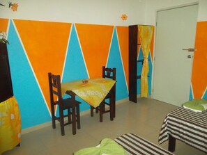 Basic Triple Room, Multiple Beds, City View | Living area