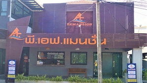 A building with a sign for 'Ermansion' and Thai text. - P.F Mansion (Koh Samui)