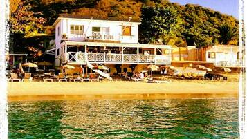 On the beach, white sand, beach bar, motor boating