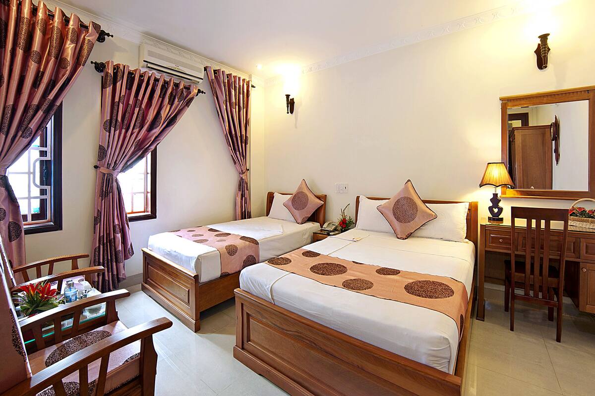 standard triple room, lake view | minibar, in-room safe, desk, blackout curtains